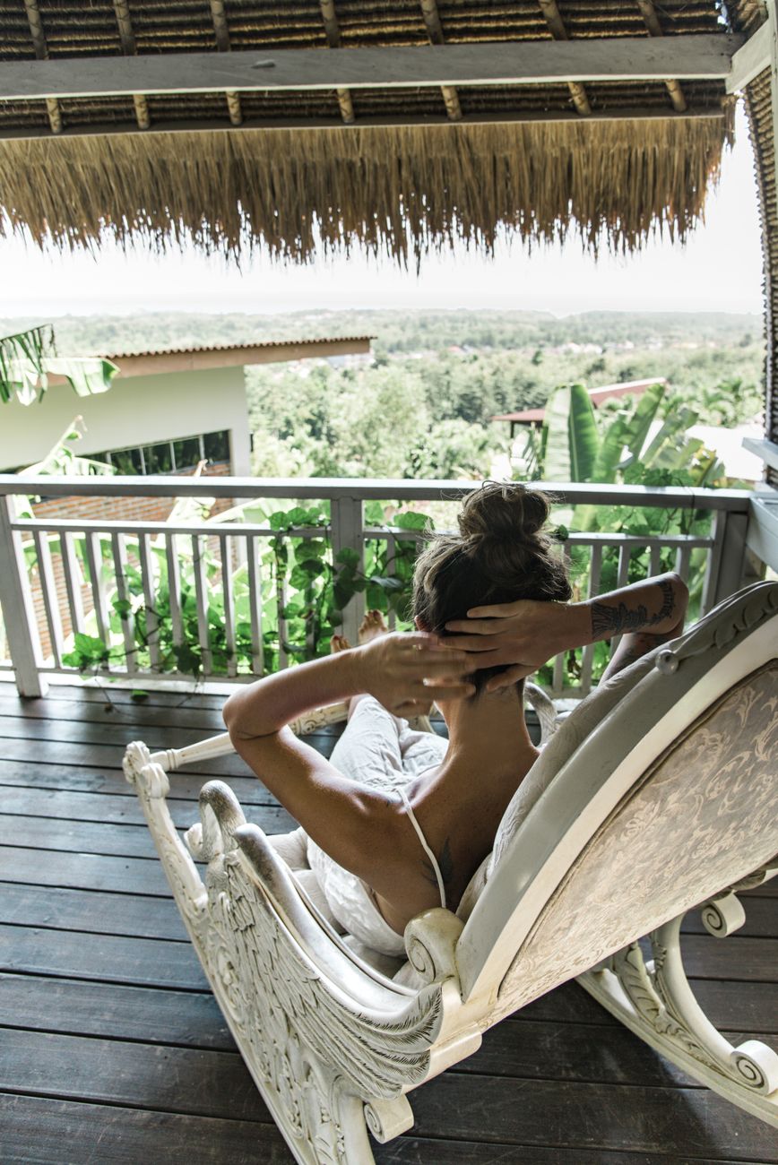 Travel writer contemplating mountain vista